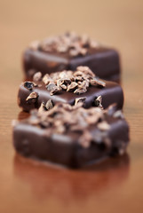 Three chocolates with nuts
