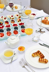 Table set up for continental breakfast: muesli