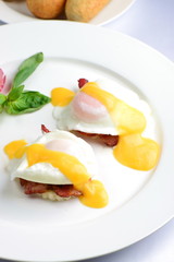 Eggs Benedict- toasted English muffins, ham, poached eggs