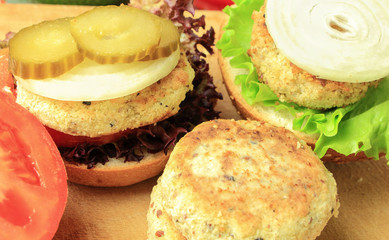 Vegan sea burger and patties closeup on wooden surface