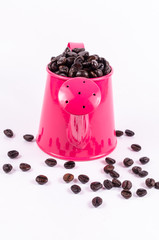 Fototapeta na wymiar roasted coffee beans in pink water can