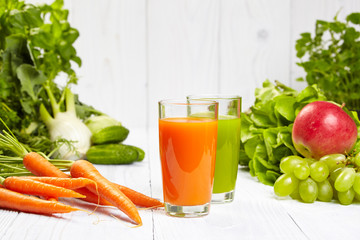 carrot juice on white wood table