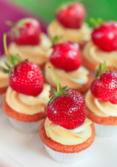 Cup-cakes with strawberry close-up