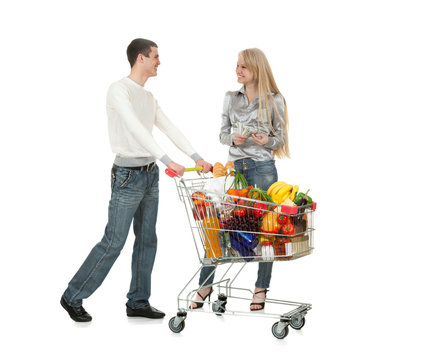 Young Couple And Shopping Trolley of Food