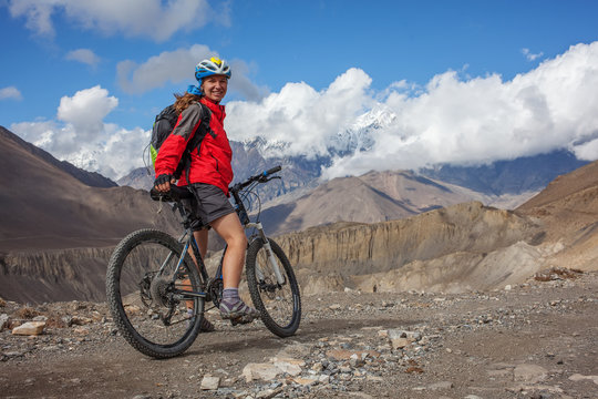 Biker-girl in Himalaya mountains, Anapurna region