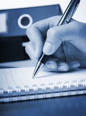 closeup of businesswoman's hand is planning