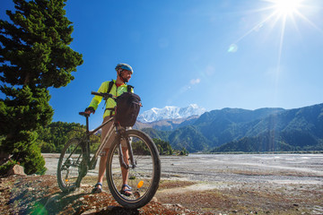 Naklejka na ściany i meble Biker-boy in Himalaya mountains, Anapurna region