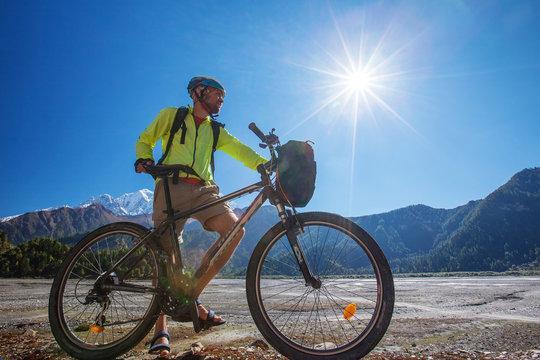 Biker-boy in Himalaya mountains, Anapurna region