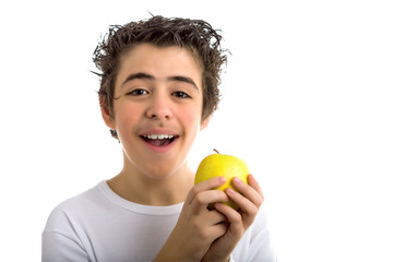 smiling boy holding a yellow apple