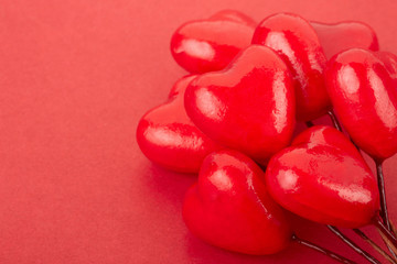 Heart glossy bunch border on red background