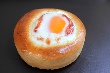 bun stuffed with the baked egg.