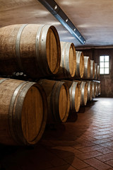 Oak barrels in the cellar. Winery	