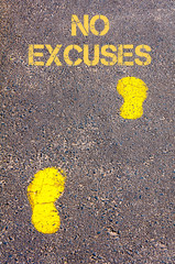 Yellow footsteps on sidewalk towards No excuses message