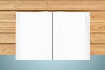White blank open book on wooden planks