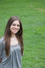 Naklejka premium Girl in grass
