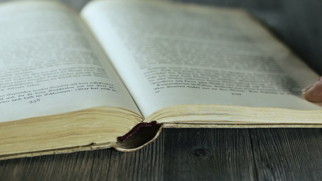 Turning the pages of an antique book