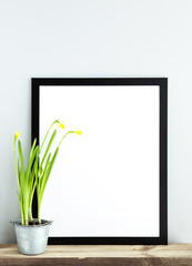black frame with place for text. Narcissus. Scandinavian room