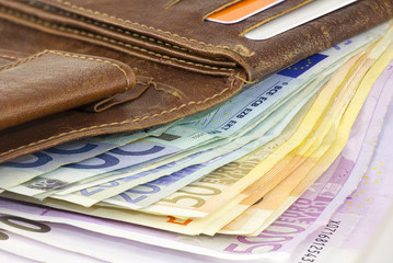 Leather wallet full of Euro banknotes