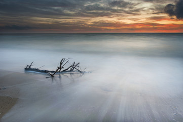 Deserted beach at sunset