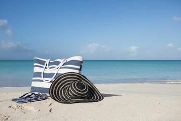 baech bag flip-flops and hat