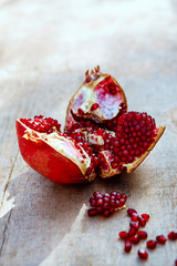 pomegranates on a  wooden background