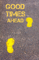 Yellow footsteps on sidewalk towards Good Times Ahead message