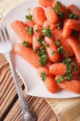 glazed carrots with parsley on the plate horizontal top view