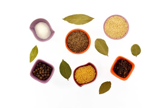 Various kinds of spices in tiny cups