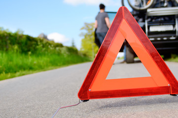 Car Trouble - woman is waiting for road assistance