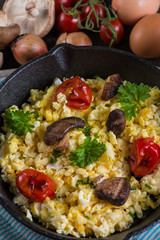 healthy breakfast,frying scramble eggs and grilled vegetables