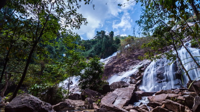 Timelapse of passing cloud and waterfall in Thailand