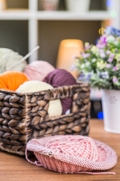 Balls of knitting yarns in the basket