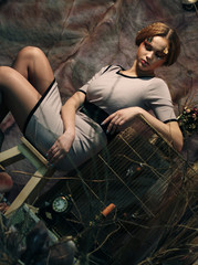 Obraz na płótnie Canvas fashion model sitting on a stool