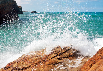 wave and splashes on beach of cathedrals in ribadeo, Galicia, Sp