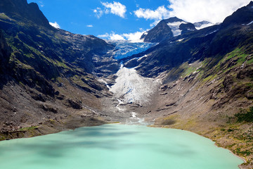 Lake and Glacier Trift, view from bridge for hanging in Alps. Ca