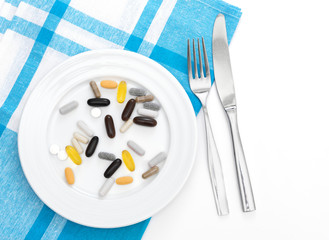 Capsules on white plate