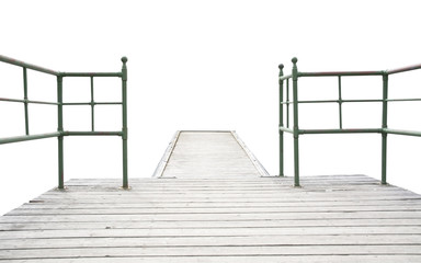 Wood pier with iron railing isolated on white.
