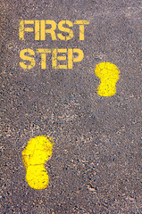 Yellow footsteps on sidewalk towards First Step message