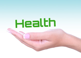 Female hand with word Health on light blue background