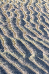 Frost on ripples of sand abstract