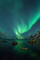 Fototapeta na wymiar Northern lights above a lake