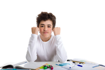 Young boy smiling on homework makes success gesture