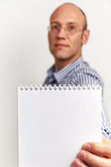 Businessman shows blank diary