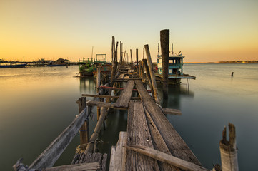 Wooden bridge in sunset