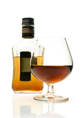 Bottle of brandy and a glass