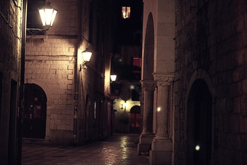 Fototapeta na wymiar Night street in the old town stone fortress