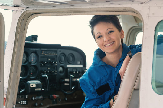 Young woman airplane pilot portrait.