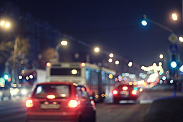 Night road in the city of lights cars traffic jams