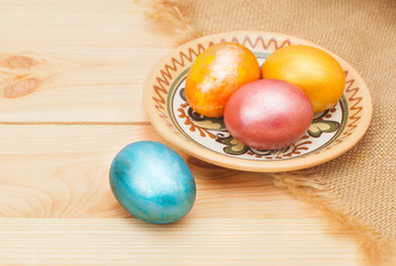 painted eggs for Easter, on wooden table