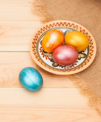 painted eggs for Easter, on wooden table